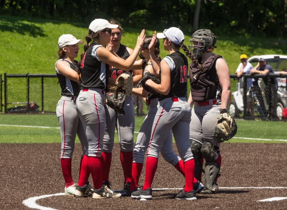 Tappan Zee infielders huddle up during the Class A softball regional final against Section 4's Vestal at Lakeland High School on Saturday, June 4, 2022.