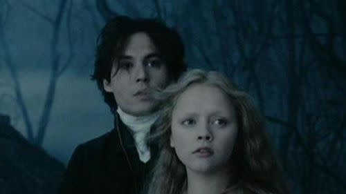 ichabod crane and katrina van tassel look into the distance in a scene from 'the legend of sleepy hollow,' a good housekeeping pick for best halloween movies