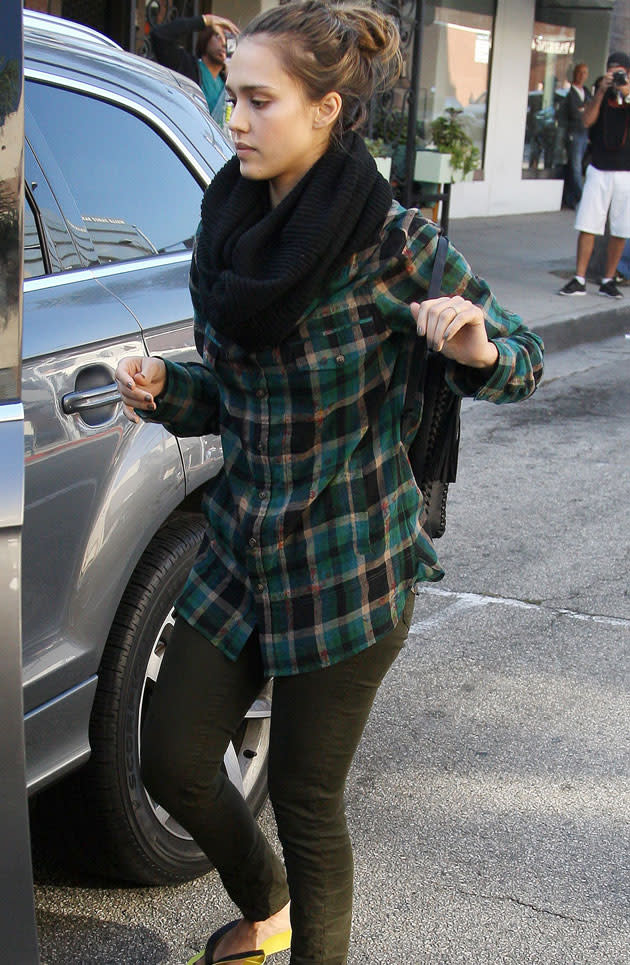 jessica Alba paired a green tartan shirt with black jeans and a snood