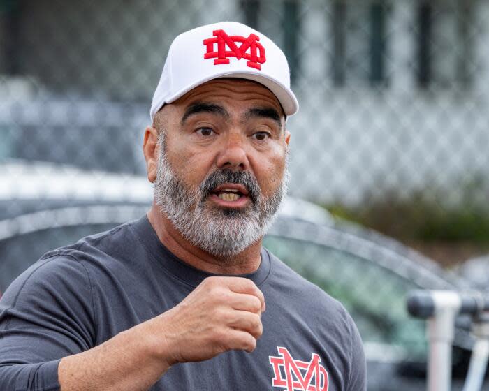 Long Beach, CA - May 18: Mater Dei varsity football head coach Raul Lara coaches the team after a game with Upland in the Long Beach Tournament of Champions at Long Beach Millikan High School Saturday, May 18, 2024. (Allen J. Schaben / Los Angeles Times)