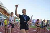 FILE - Gold medalist Katie Moon and silver medalist Hana Moll, behind, react to the crowd after the medal ceremony for the women's pole vault during the U.S. track and field championships in Eugene, Ore., Sunday, July 9, 2023. (AP Photo/Ashley Landis, File)