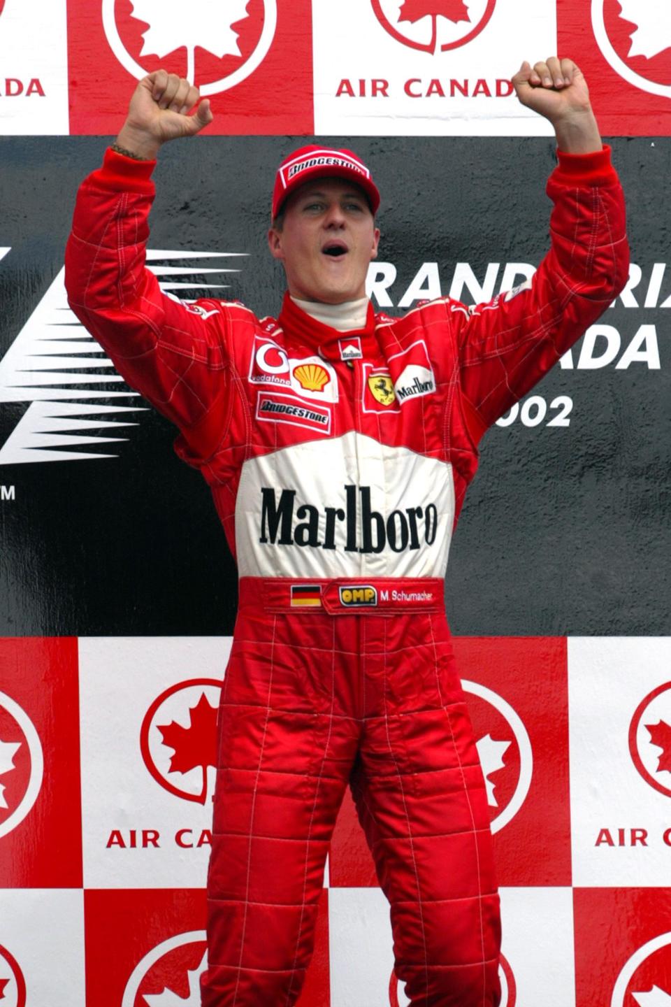 Ferrari's Michael Schumacher celebrates victory in the Canadian Grand Prix.