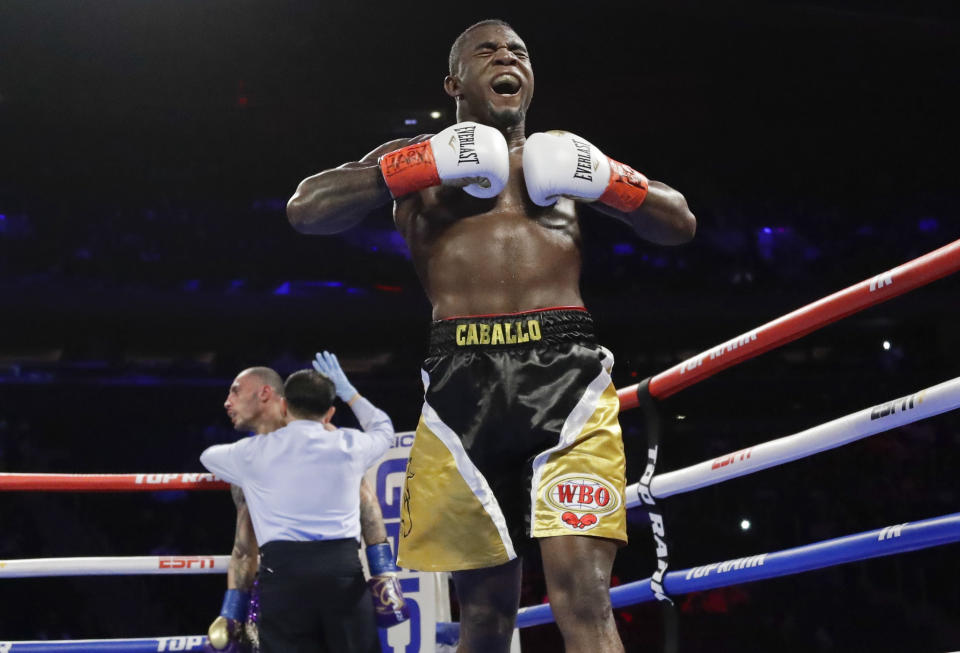 FILE - Dominican Republic's Carlos Adames, right, reacts after beating Frank Galarza in a super welterweight championship boxing match Saturday, April 20, 2019, in New York. The World Boxing Council has stripped unbeaten Jermall Charlo of his middleweight title following his arrest this week on suspicion of drunken driving in Texas. The organization's Board of Governors on Tuesday, May 7, 2024, named Carlos Adames its champion in the division. Charlo hasn't defended his title since 2021, and Adames became interim champion in October 2022. (AP Photo/Frank Franklin II, File)