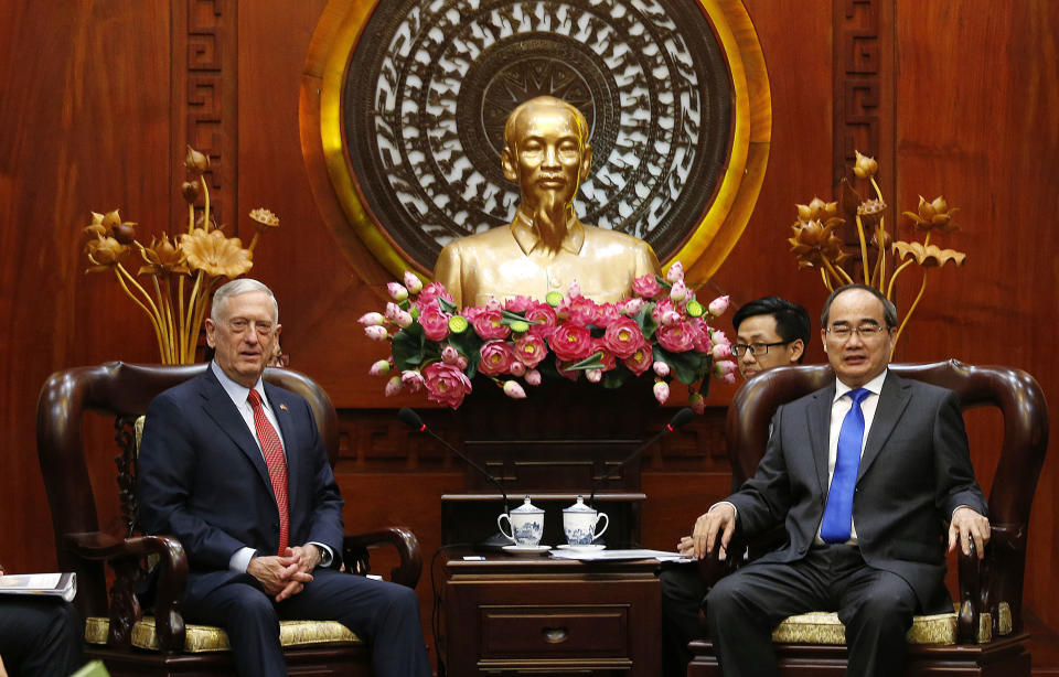 U.S. Defense Secretary Jim Mattis, left, meets Ho Chi Minh City's communist party chief Nguyen Thien Nhan in Ho Chi Minh City, Vietnam Tuesday, Oct. 16, 2018. (Kham/Pool Photo via AP)