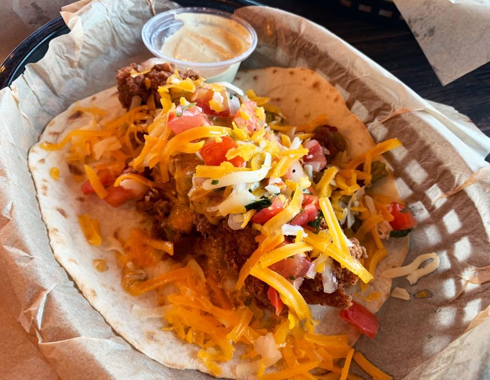 The Trailer Park Hillbilly style is a secret menu item at Torchy's that features a lob of fried chicken with chorizo and bacon.