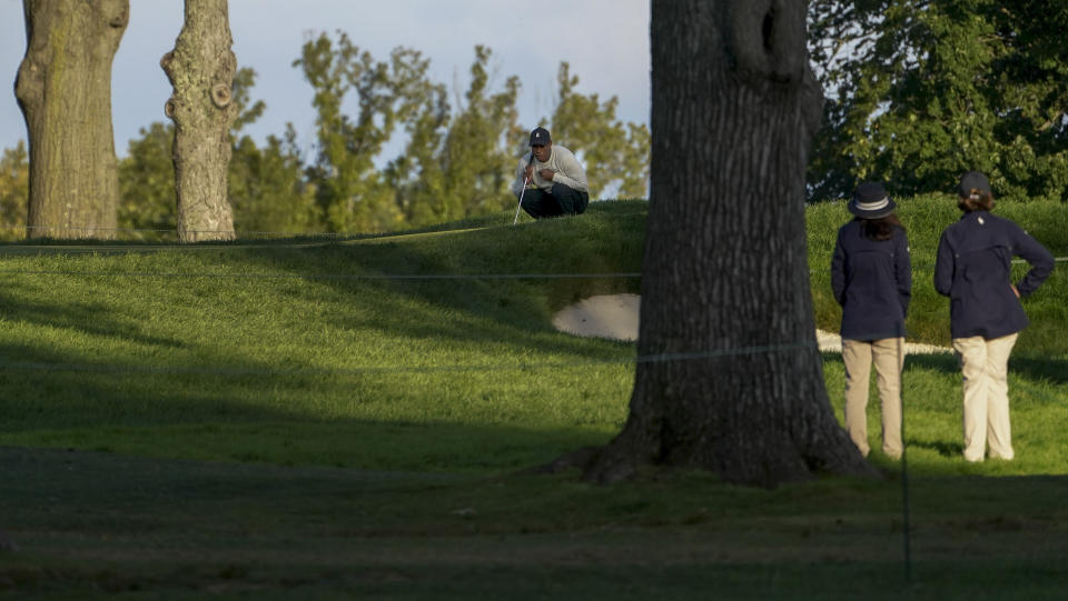 Tiger Woods, of the United States, lines up a shot on the fifth green during the second round of the US Open Golf Championship, Friday, Sept. 18, 2020, in Mamaroneck, N.Y. (AP Photo/John Minchillo)