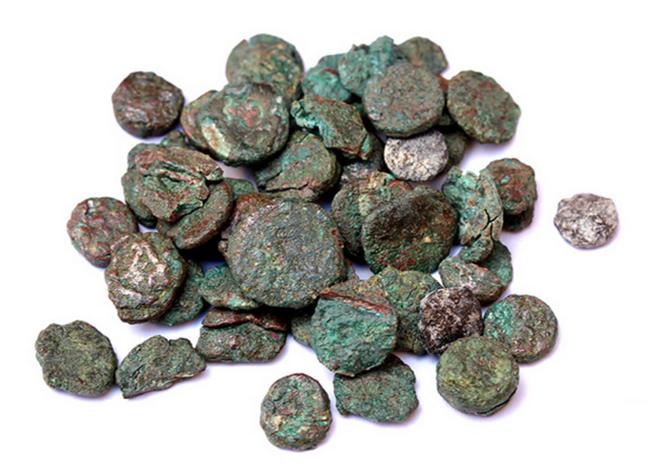 More than 8,000 coins were unearthed from the ancient city, researchers said.