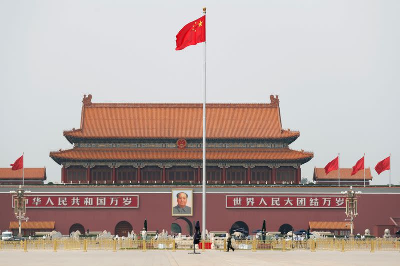 The Chinese flag flutters on Tiananmen Square before the opening session of CPPCC in Beijing