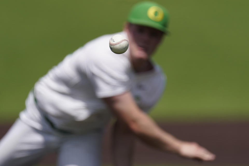 Oregon pitcher Josh Mollerus pitches against Xavier during the ninth inning of an NCAA college baseball tournament regional game Friday, June 2, 2023, in Nashville, Tenn. (AP Photo/George Walker IV)