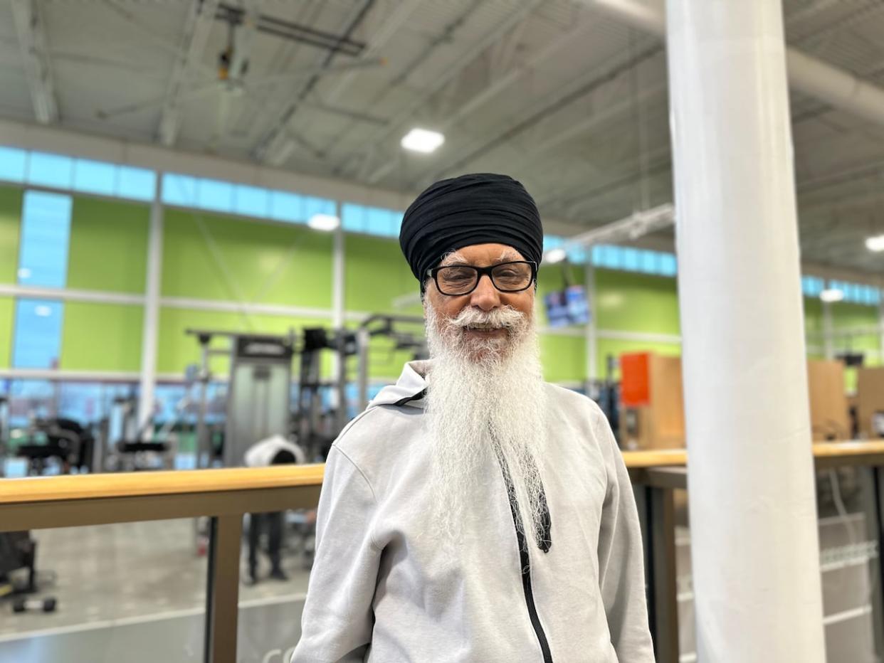 Retired Brampton resident Durlabh Gill, 79, visits the city-run Cassie Campbell Community Centre to remain in shape after sitting for 10 hours during volunteer work at a Sikh Temple. He says he is happy about the city's new program, which will make recreational services free for residents aged 70 and above.  (Saloni Bhugra/CBC - image credit)