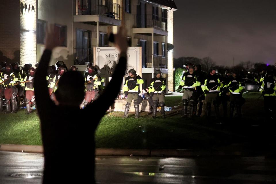 <div class="inline-image__caption"><p>Demonstrators face off with police officers outside of the Brooklyn Center police station on April 12, 2021 in Brooklyn Center, Minnesota.</p></div> <div class="inline-image__credit">Photo by Scott Olson/Getty Images</div>
