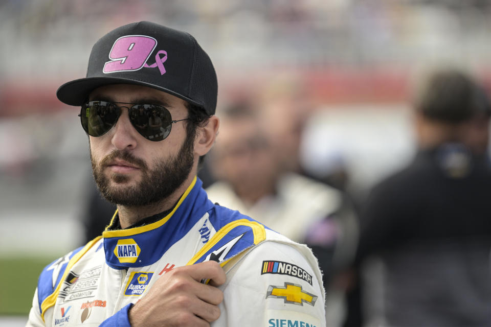 FILE - Chase Elliott (9) looks on prior to a NASCAR Cup Series auto race at Charlotte Motor Speedway, Sunday, Oct. 9, 2022, in Concord, N.C. The only thing on Elliott’s mind this weekend is winning as he returns to racing at Martinsville Speedway after missing six races with a broken left leg sustained during a snowboarding accident. (AP Photo/Matt Kelley, File)