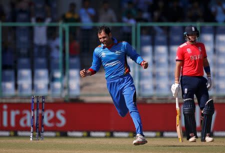 Cricket - England v Afghanistan - World Twenty20 cricket tournament - New Delhi, India, 23/03/2016. Afghanistan's Mohammad Nabi celebrates taking the wicket of England's captain Eoin Morgan. REUTERS/Adnan Abidi