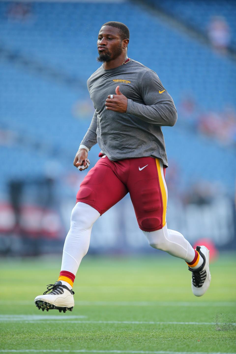 Washington Football Team linebacker Jon Bostic (53) warms up prior to an NFL preseason football game against the New England Patriots, Thursday, Aug. 12, 2021, in Foxborough, Mass.