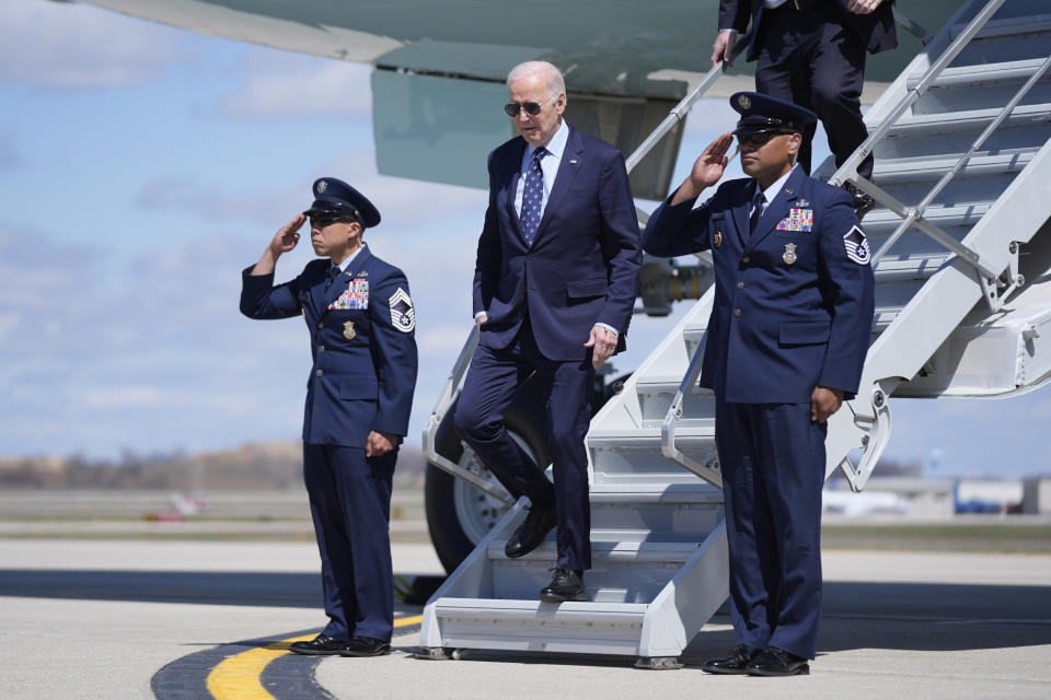 President Joe Biden, center, arrives on Air Force One at Dane County Regional Airport for an event on student loan debt at Madison College, Monday, April 8, 2024, in Madison, Wis. (AP Photo/Evan Vucci)