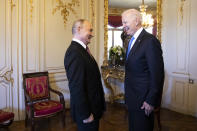 Russian president Vladimir Putin, left, talks with US president Joe Biden, right, during the US - Russia summit in Geneva, Switzerland, Wednesday, June 16, 2021. (Peter Klaunzer/Swiss Federal Office of Foreign Affairs via AP)
