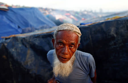 A Rohingya refugee stands outside his temporary shelter at a makeshift camp in Cox's Bazar, Bangladesh, September 17, 2017. REUTERS/Danish Siddiqui