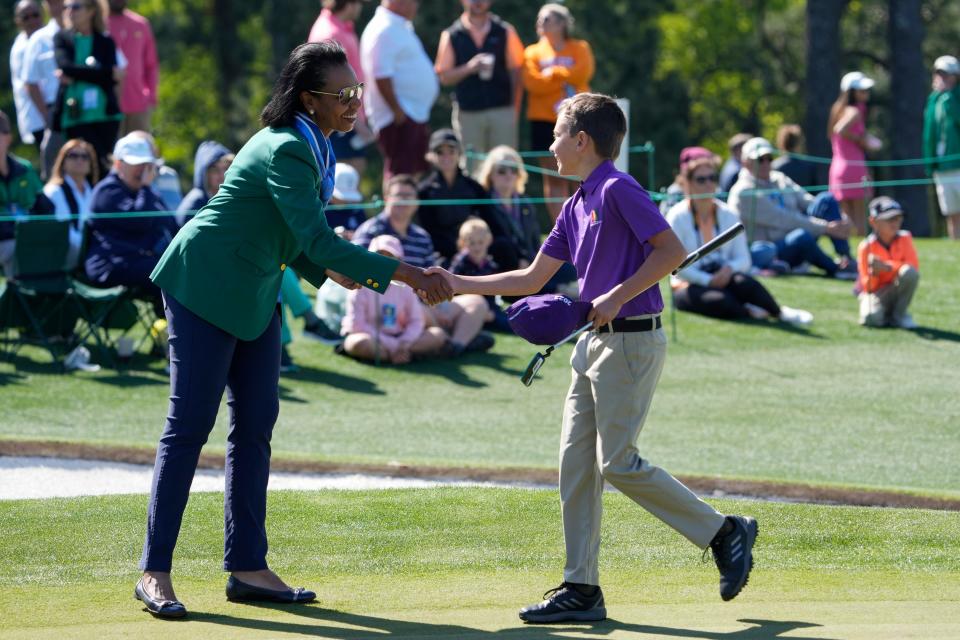 Apr 3, 2022; Augusta, Georgia, USA; Augusta National Golf Club member Condoleezza Rice congratulates Judd Nikkel of Fort Collins, Colorado during the Drive, Chip & Putt National Finals at Augusta National Golf Club.