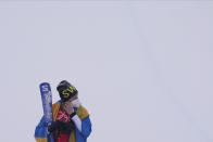 Gold medal winner Sweden's Sandra Naeslund celebrates during the venue award ceremony for the women's cross at the 2022 Winter Olympics, Thursday, Feb. 17, 2022, in Zhangjiakou, China. (AP Photo/Gregory Bull)