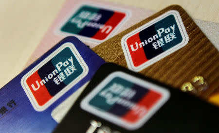 Logos of China UnionPay are seen on bank cards in this photo illustration taken in Beijing December 5, 2013. P REUTERS/Barry Huang/File Photo