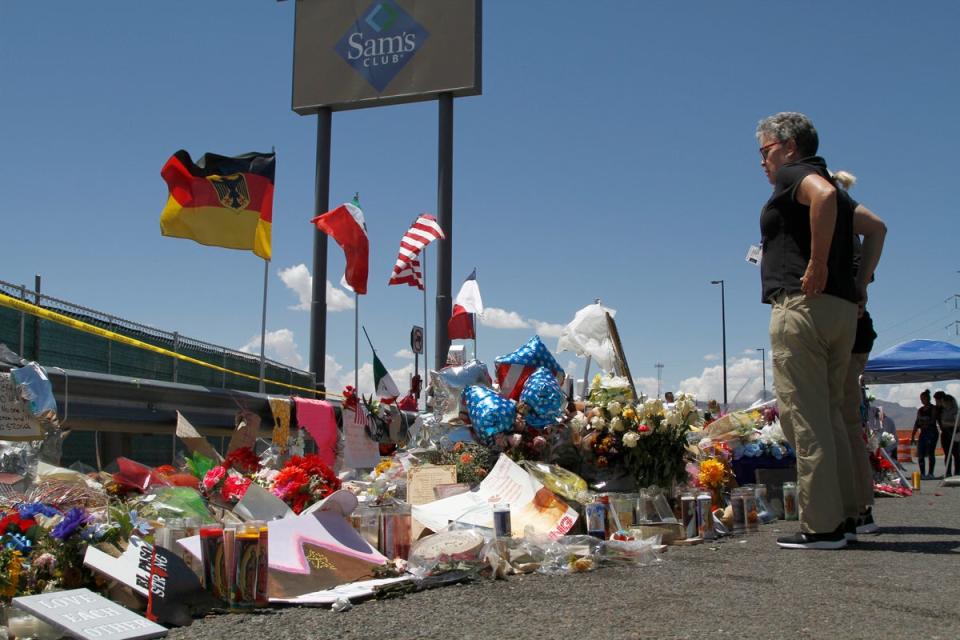 Mourners visit a makeshift memorial near the Walmart in El Paso, Texas, following the mass shooting (Copyright 2019 The Associated Press. All rights reserved.)