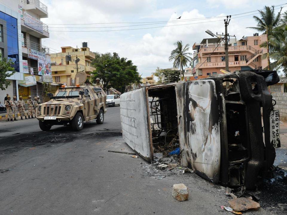 A water sharing dispute saw dozens of buses and cars set on fire by protesters (AFP/Getty)