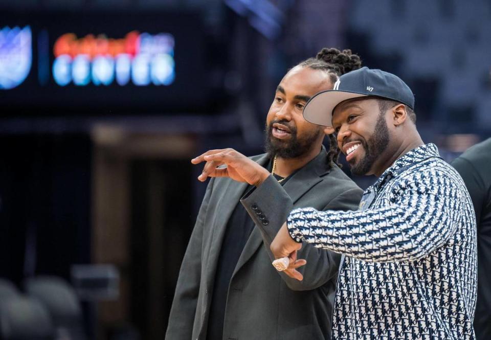 Kings and Queens Rise Co-Ed Youth Sports and Mentoring League Commissioner Kenneth Duncan, left, speaks with entertainer and businessman Curtis “50 Cent” Jackson during a Sacramento Kings event presented by the G-Unity Foundation at Golden 1 Center on Saturday, June 10, 2023, to kick off the league’s sixth season in Sacramento. Xavier Mascareñas/xmascarenas@sacbee.com