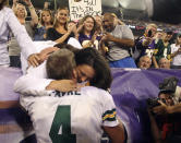 <p>Green Bay Packers quarterback #4 BRETT FAVRE hugs his wife, Deanna, after his record-setting touchdown pass to wide receiver Greg Jennings in first quarter of football game against the Minnesota Vikings. Favre set the NFL record for career touchdown passes at 421 surpassing Dan Marino Minnesota Vikings at Metrodome in Minneapolis, Minn. The Packers won 23-16. (Photo by Jay Drowns/Sporting News via Getty Images)</p>