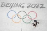 Karina Safina and Luka Berulava, of Gerogia, compete during the pairs short program figure skating competition at the 2022 Winter Olympics, Friday, Feb. 4, 2022, in Beijing. (AP Photo/Jeff Roberson)