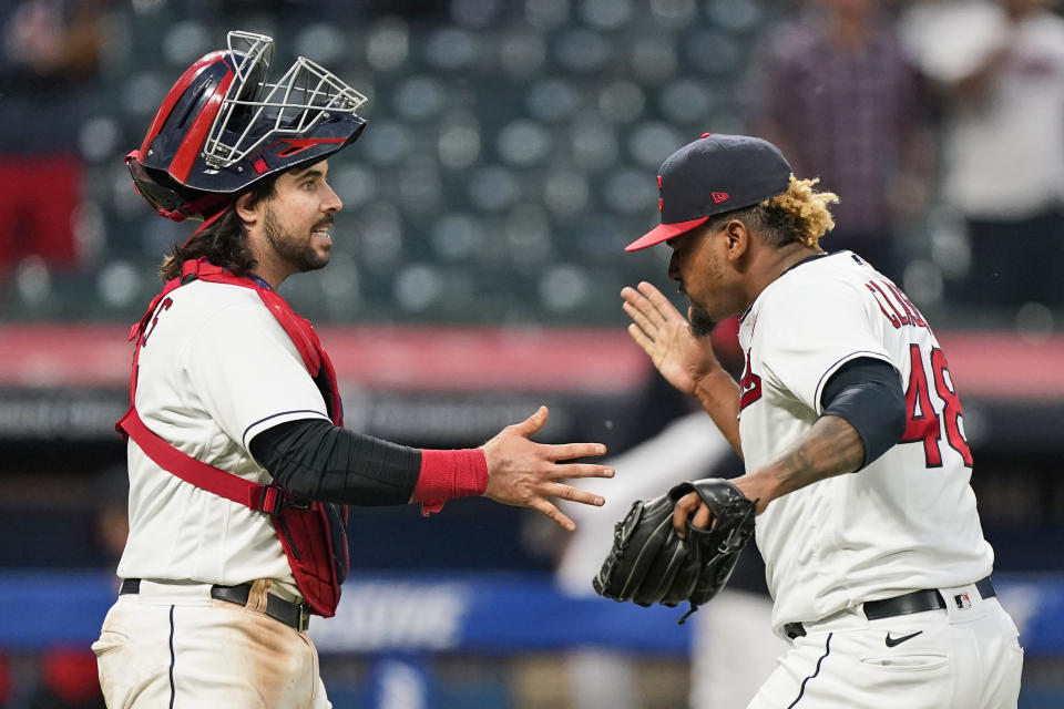 Cleveland Indians relief pitcher Emmanuel Clase, right, is congratulated by catcher Austin Hedges after the Indians defeated the Chicago White Sox 3-1 in the second baseball game of a doubleheader, Monday, May 31, 2021, in Cleveland. (AP Photo/Tony Dejak)