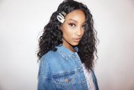 Add a few mini braids and a stack of clips to dress up your curls or waves.