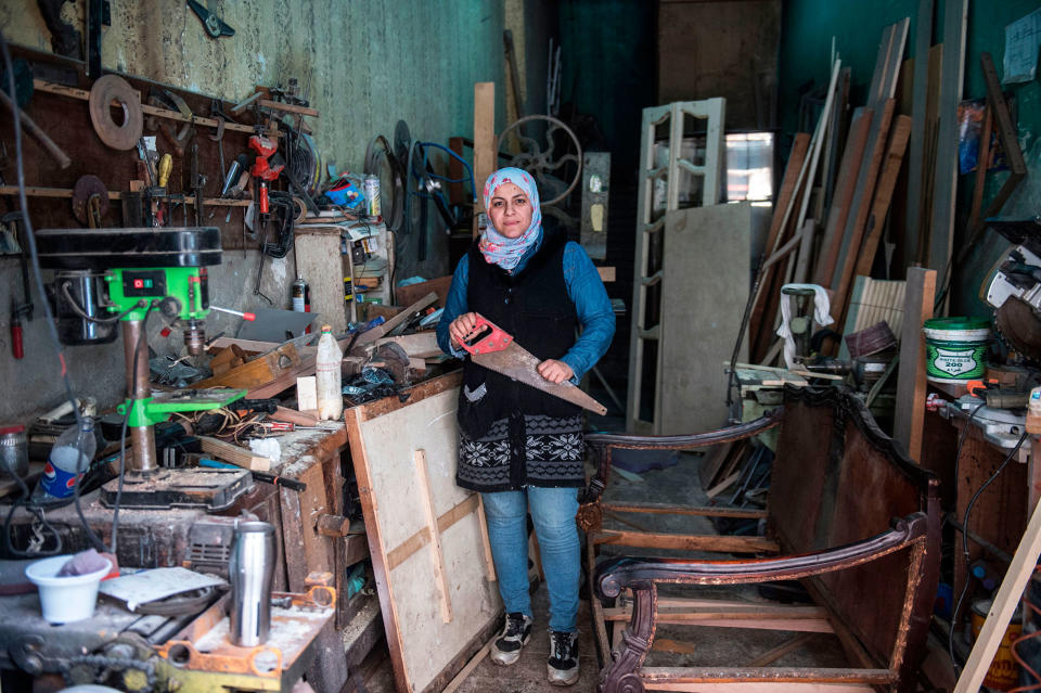 <p>Asmaa Megahed, a 31-year-old Egyptian carpenter, poses for a picture at her workshop in Abdeen district in downtown Cairo, Egypt, on February 26, 2018. (Photo: Khaled Desouki/AFP/Getty Images) </p>