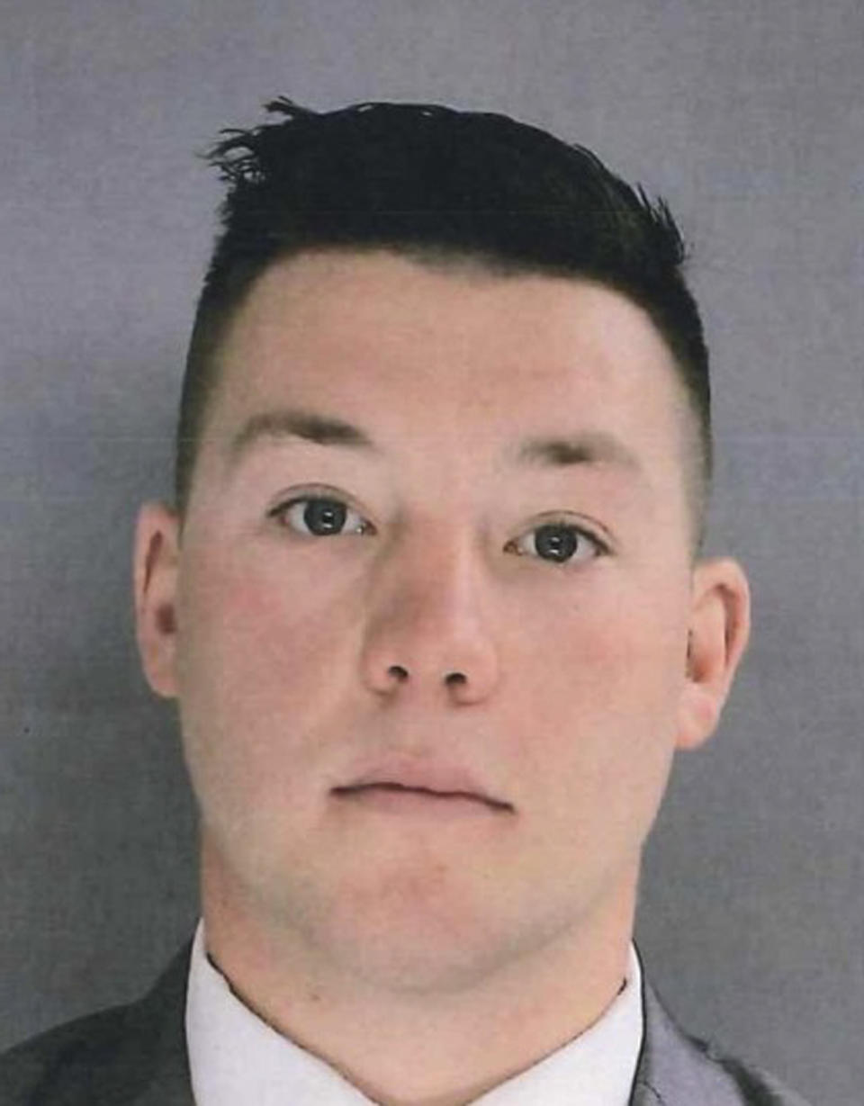 In this photo provided by the Delaware County District Attorney's Office on Tuesday, Jan. 18, 2022, shows Sharon Hill Police officer Sean Dolan. Dolan is one of three police officers that have been charged with manslaughter and reckless endangerment after firing their weapons into a crowd of people exiting a high school football game outside of Philadelphia, killing 8-year-old Fanta Bility and injuring three people. (Delaware County District Attorney's Office vis AP)