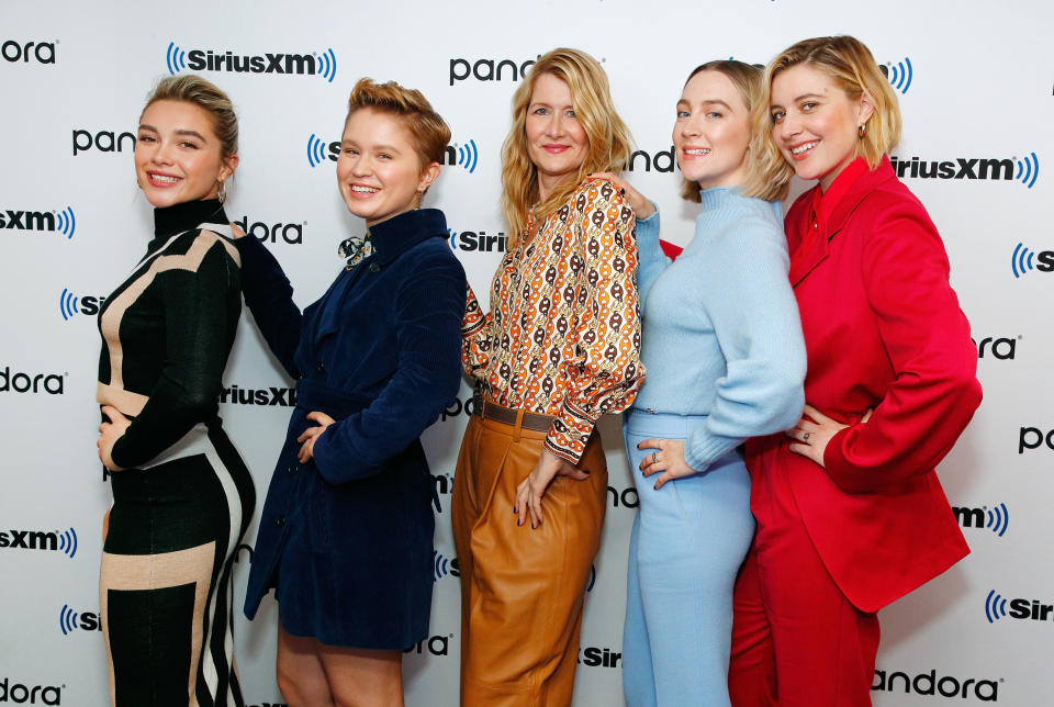 greta and the cast of little women posing with their bodies facing the side