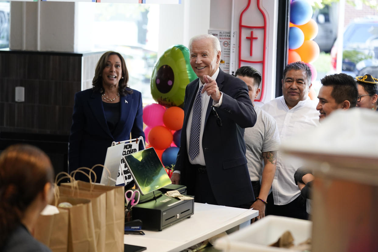 President Joe Biden points to members of the media as he and Vice President Kamala Harris visit Taqueria Habanero restaurant on Friday, May 5, 2023, in Washington. (AP Photo/Evan Vucci)