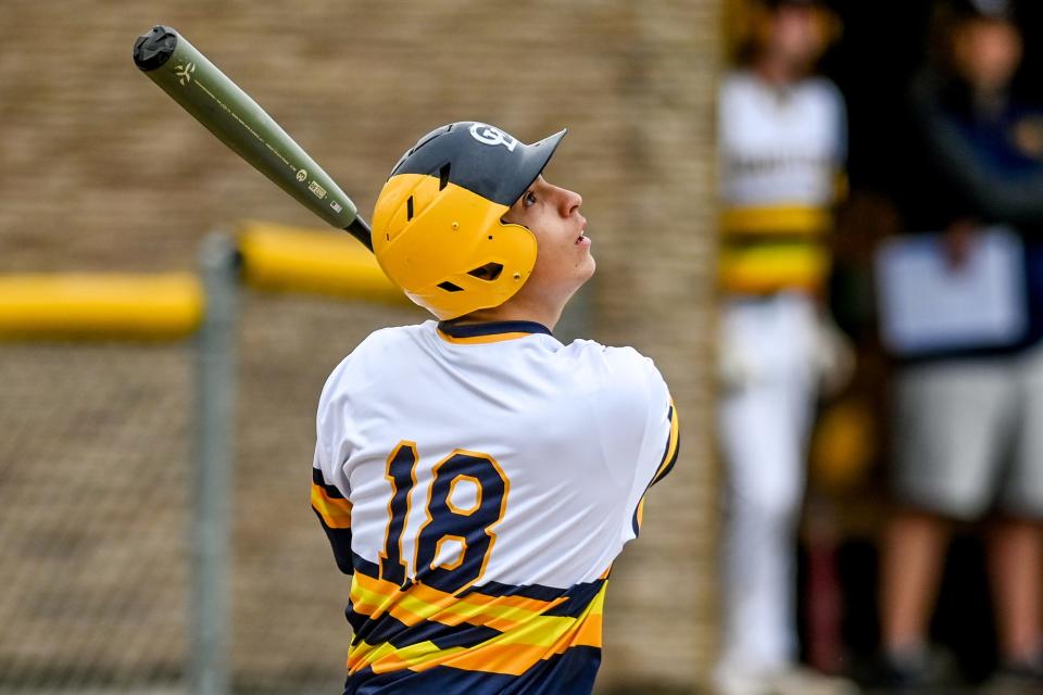 Grand Ledge's Caleb Estrada connects on a Portland pitch in the fifth inning on Thursday, May 27, 2021, during the Diamond Classic at Grand Ledge High School.