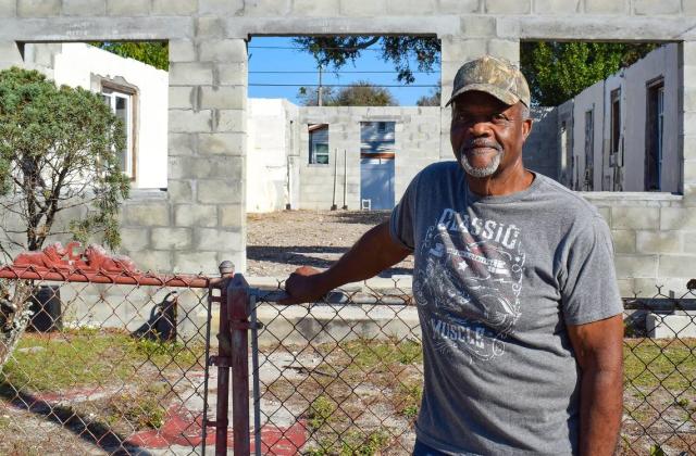 Wade Clark stands in front of the shell of the Clearwater home he lost after the city foreclosed on it over unpaid code enforcement fines. The roof needed to be prepared and the house, which Clark’s father originally built, hasn’t been improved since it was taken from Clark.