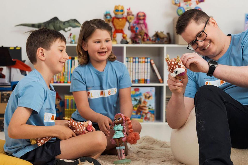 Johnny Ruffo with two children from the Starlight Children's Foundation