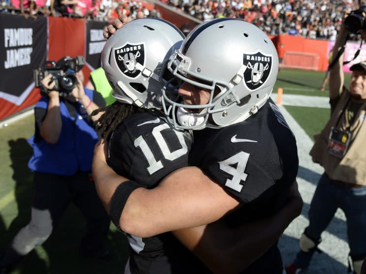 Derek Carr (4) hit Seth Roberts (10) for a game-winning touchdown in overtime (AP)