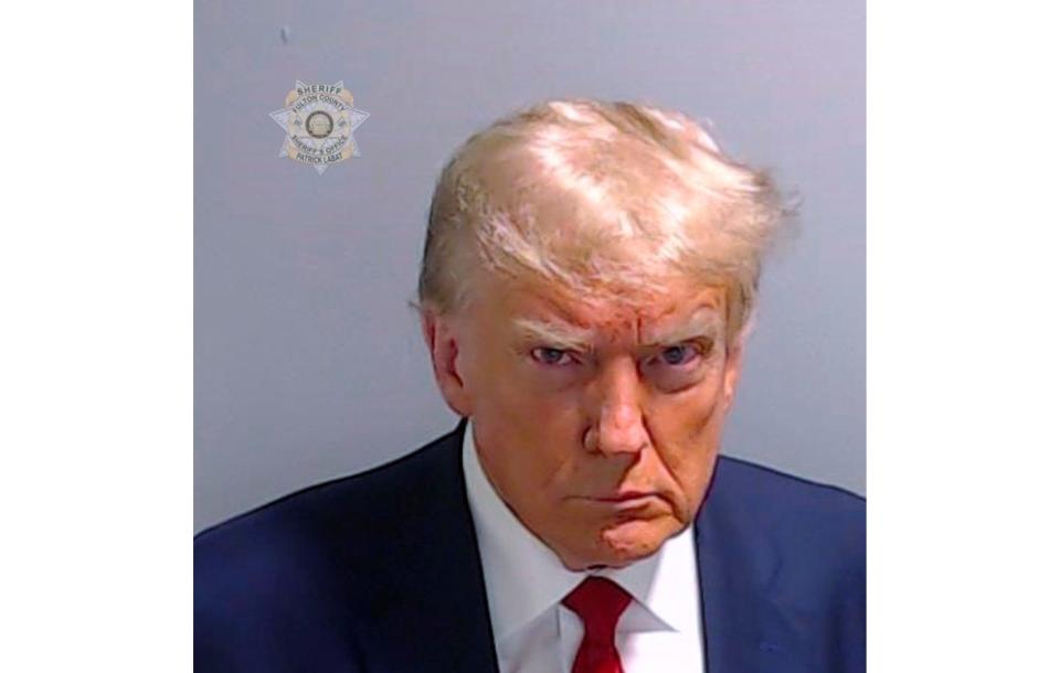 This booking photo provided by the Fulton County Sheriff’s Office shows former President Donald Trump on Thursday, Aug. 24, 2023, after he surrendered and was booked at the Fulton County Jail in Atlanta. Trump is accused by Fulton County District Attorney Fani Willis of attempting to subvert the will of Georgia voters in a bid to keep Joe Biden out of the White House. (Fulton County Sheriff’s Office via AP)