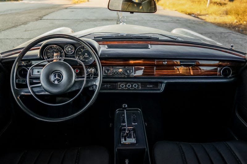 The black and wood interior of a 1971 Mercedes-Benz 300SEL 6.3