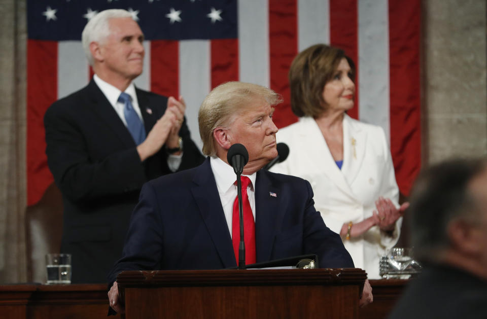 FILE - In this Feb. 4, 2020, file photo, President Donald Trump look to the first lady's box before delivering his State of the Union address to a joint session of Congress in the House Chamber on Capitol Hill in Washington, as Vice President Mike Pence and Speaker Nancy Pelosi watch. Trump and Pelosi have not spoken in five months at a time when the nation is battling its worst health crisis in a century. (Leah Millis/Pool via AP)