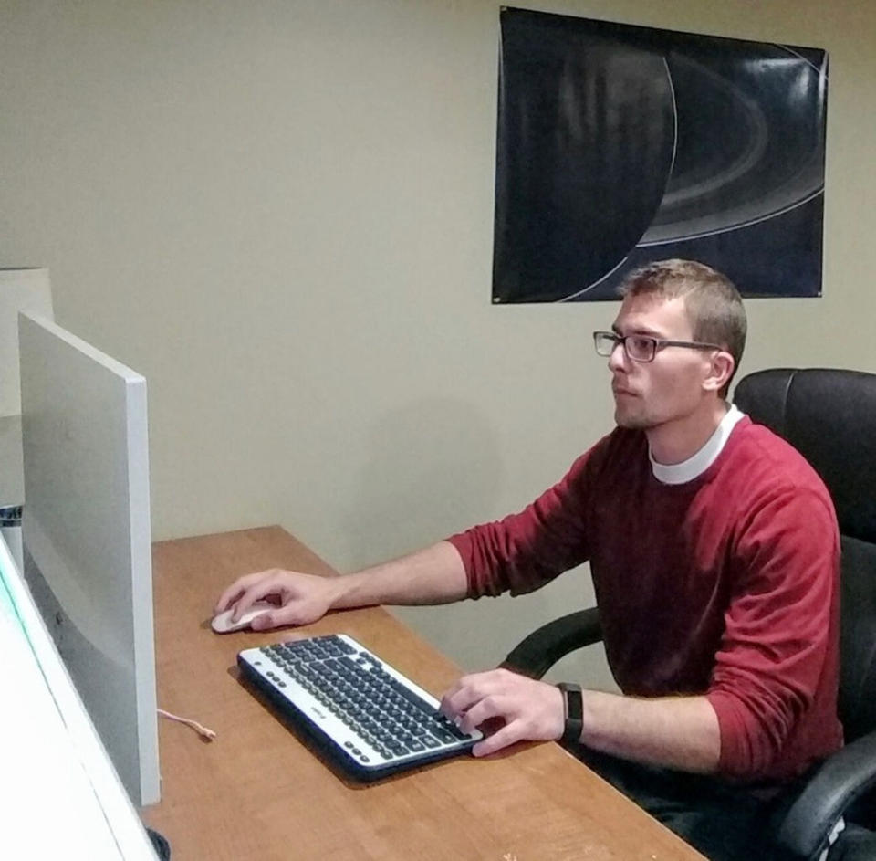 CapCom Steve Knutson at his desk. <cite>The Mars Society</cite>