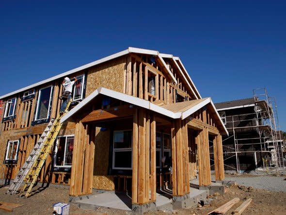  A worker installs a window in a new home under construction at a housing development September 27, 2007 in Richmond, California