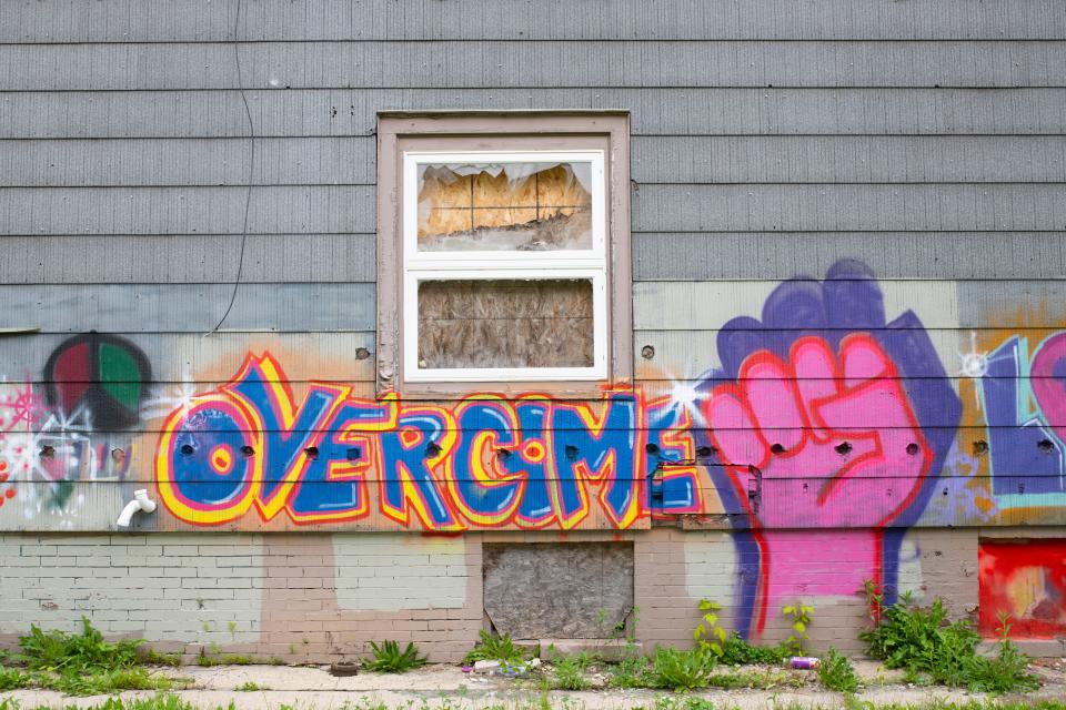 This abandoned home on 33rd Street in Milwaukee is painted with message of hope for a struggling neighborhood.