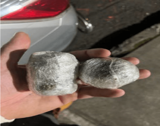 A picture of two bundles of marijuana was sent to an inmate at Rikers Island, according to court documents. (Credit: U.S. Attorney for the Southern District of New York)