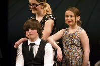 From left; Andrew Haecker, Chloe Rukavina and Ember Bradley perform a scene from “The Bullying Collection” at Wheatland High School in Wheatland, Wyoming on Friday, Jan. 12, 2024. School officials canceled the middle school play in part because it mentioned a gay character. The anti-bullying play was nonetheless performed under private sponsorship. (AP Photo/Thomas Peipert)