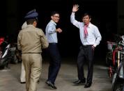 Uon Chhin and Yeang Sothearin, former journalists from the U.S.-funded Radio Free Asia (RFA), who have been charged with espionage, arrive at the Municipal Court of Phnom Penh for their verdict, in Phnom Penh