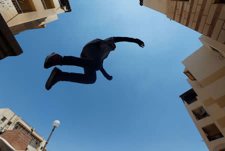 Zeinab Helal from Parkour Egypt "PKE" practices her parkour skills around buildings on the outskirts of Cairo, Egypt July 20, 2018. REUTERS/Amr Abdallah Dalsh