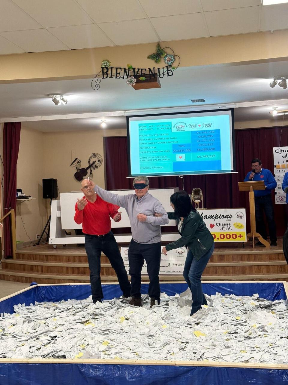 Doug Henderson was blindfolded and led into the pool of tickets to pick the winner of last week's draw.